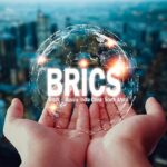 Two,Hands,Embracing,Globe,Icon,New,Currency,Concept,Of,’brics’,