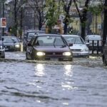Milan,,Italy-november,26,,2002:,Cars,Driving,On,A,Flooded,Road