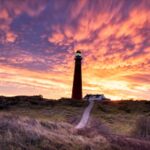 Dramatic,Purple,Mammatus,Clouds,Over,Lighthouse,At,Dawn,,Schiermonnikoog